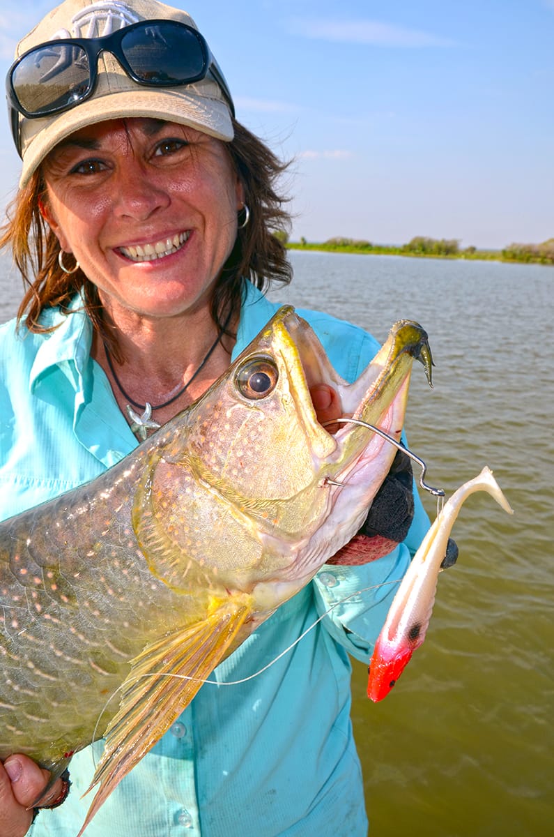 Jo with a saratoga caught on a soft plastic lure in Corroboree Billabong, NT.